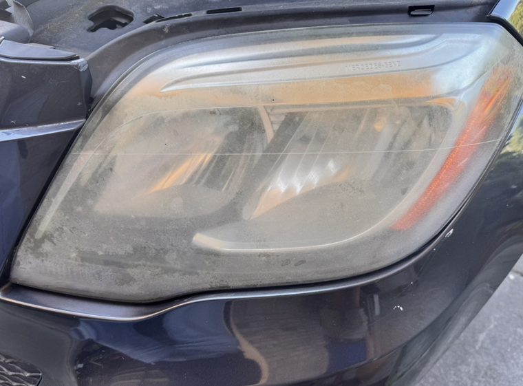 Hazed Mercedes GLK lens with unreadable stamped lettering